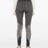 Leggingsi con stampa serpente in nero Adidas by stella mc cartney - donna 
