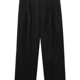 Pantaloni gessati con pieghe in nero Comme des garcons homme - uomo 