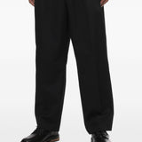 Pantaloni gessati con pieghe in nero Comme des garcons homme - uomo 