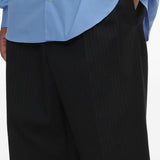 Pantaloni gessati con pieghe in nero Comme des garcons homme - uomo 