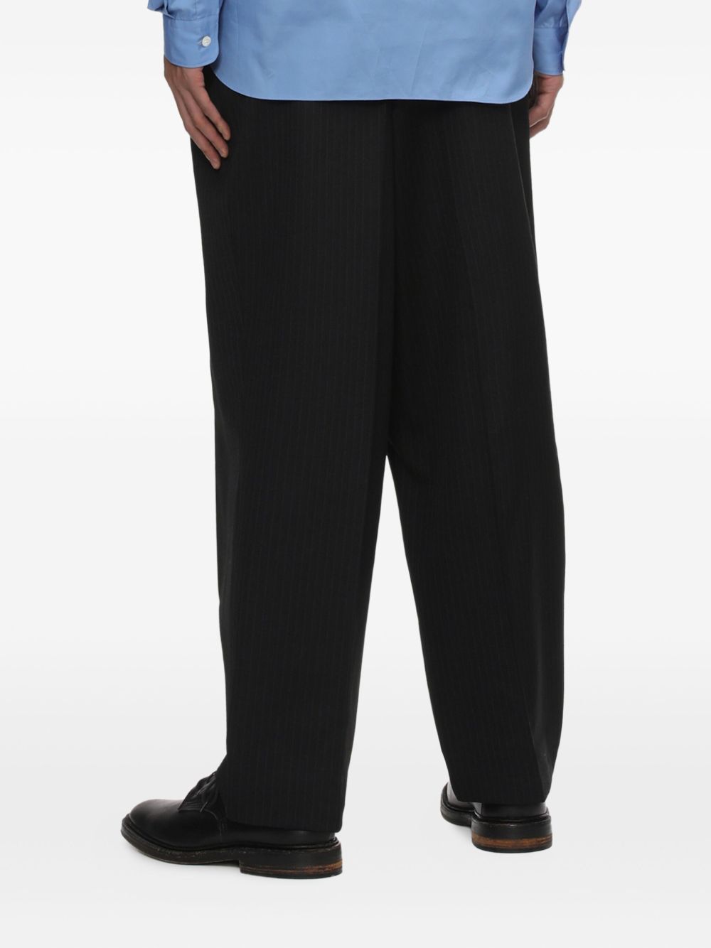 Pantaloni gessati con pieghe in nero Comme des garcons homme - uomo 