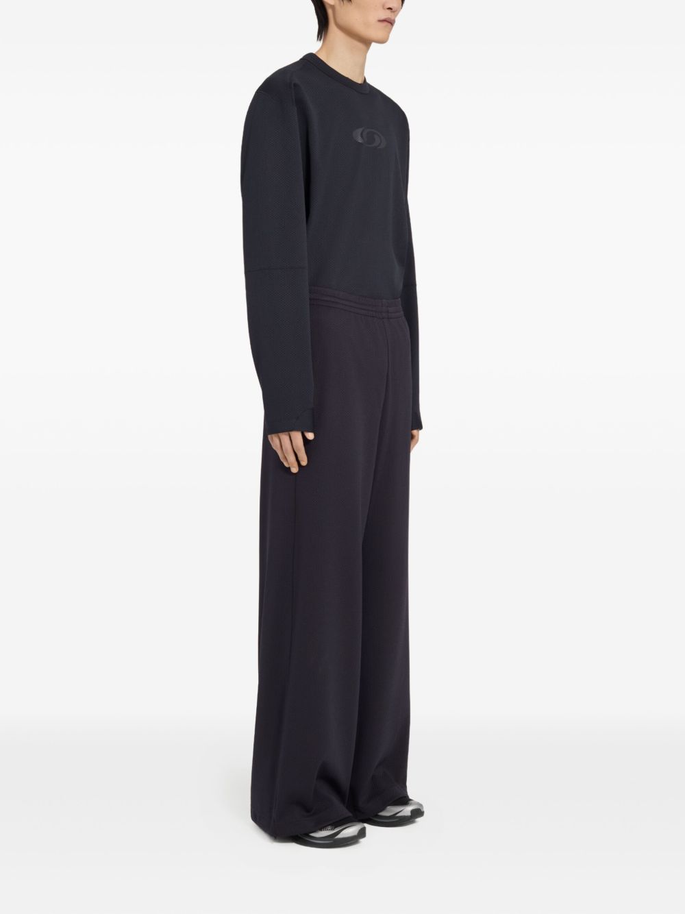 Pantaloni con coulisse sui orli in nero MM6 X Salomon - unisex 