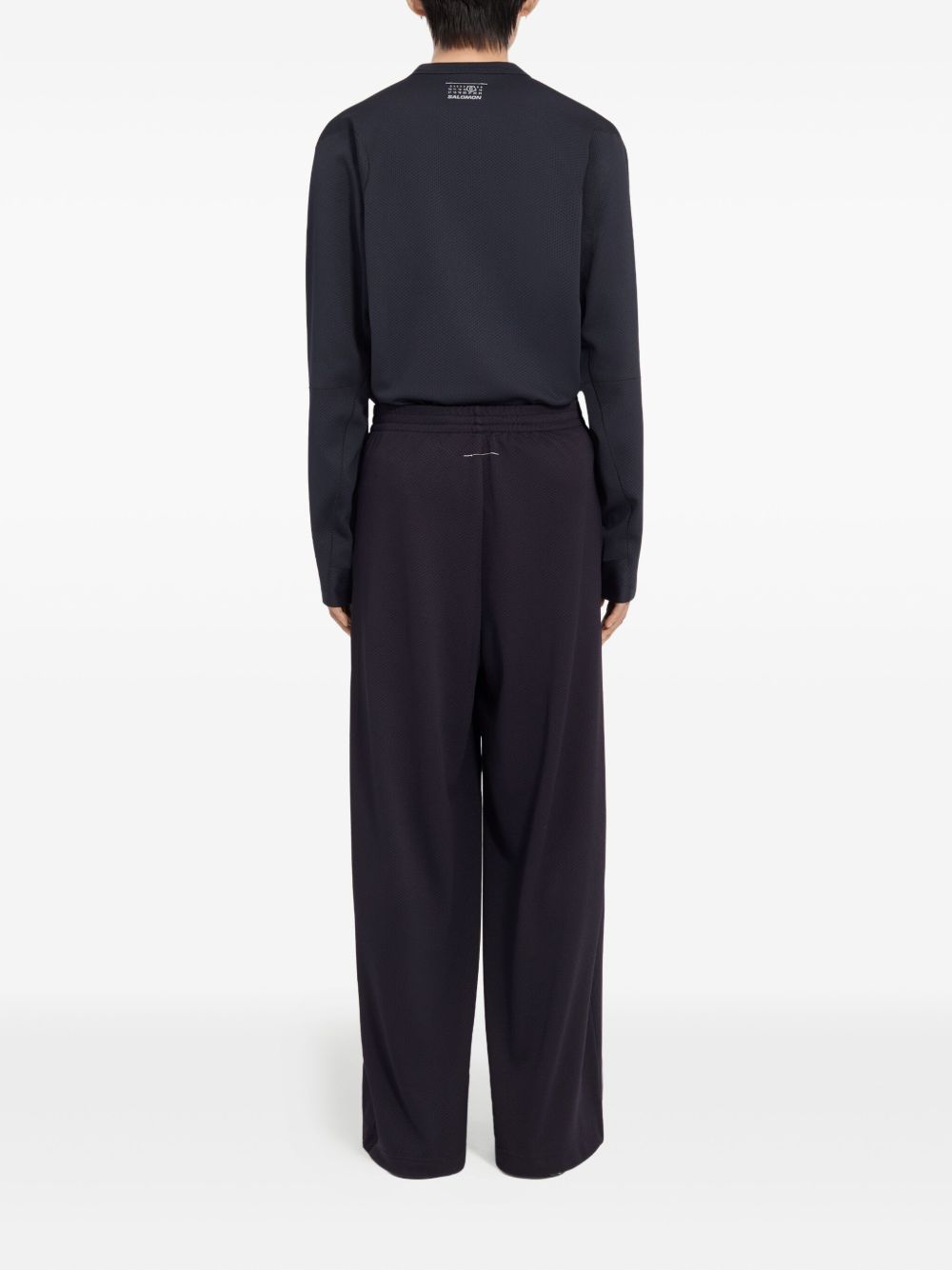 Pantaloni con coulisse sui orli in nero MM6 X Salomon - unisex 