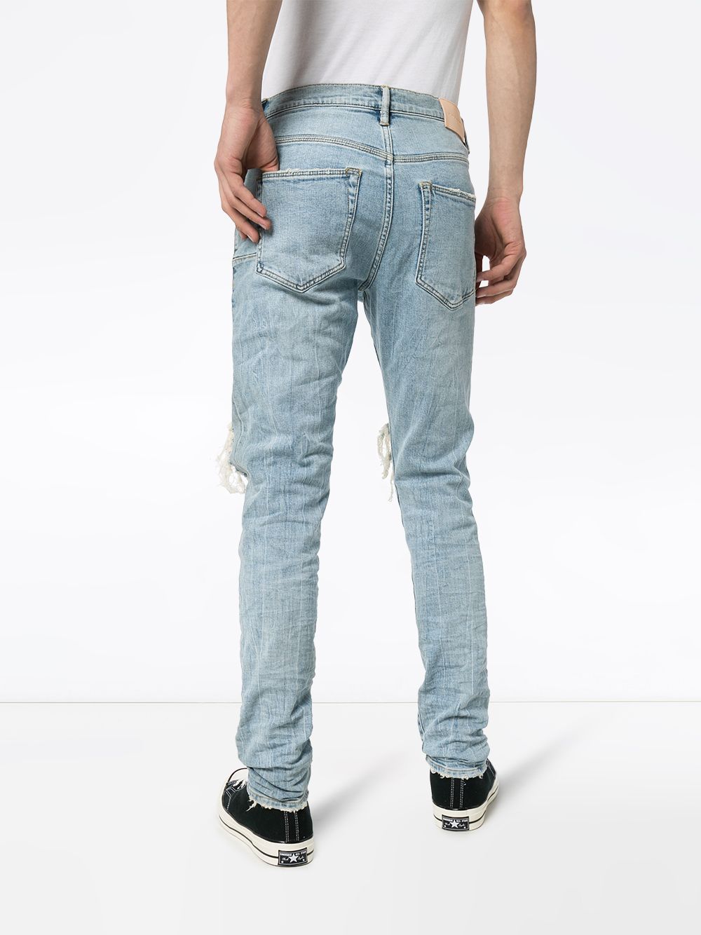 Jeans slim con strappi in blu Purple - uomo 