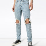 Jeans slim con strappi in blu Purple - uomo 