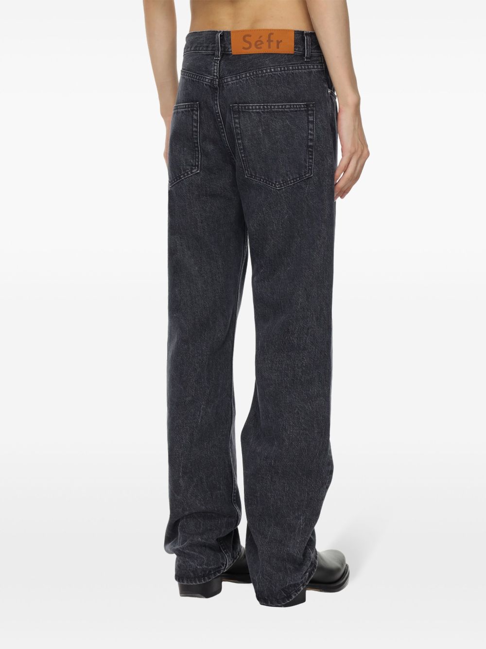 Jeans con bottoni in grigio 