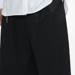 Bermuda plissettati con cintura in nero Simone rocha - uomo 
