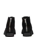 Sneakers con lacci e zip in nero 