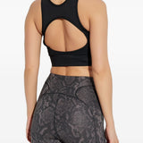 Top sportivo con logo in nero 