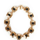 Collana in metallo e cristalli in nero e oro 