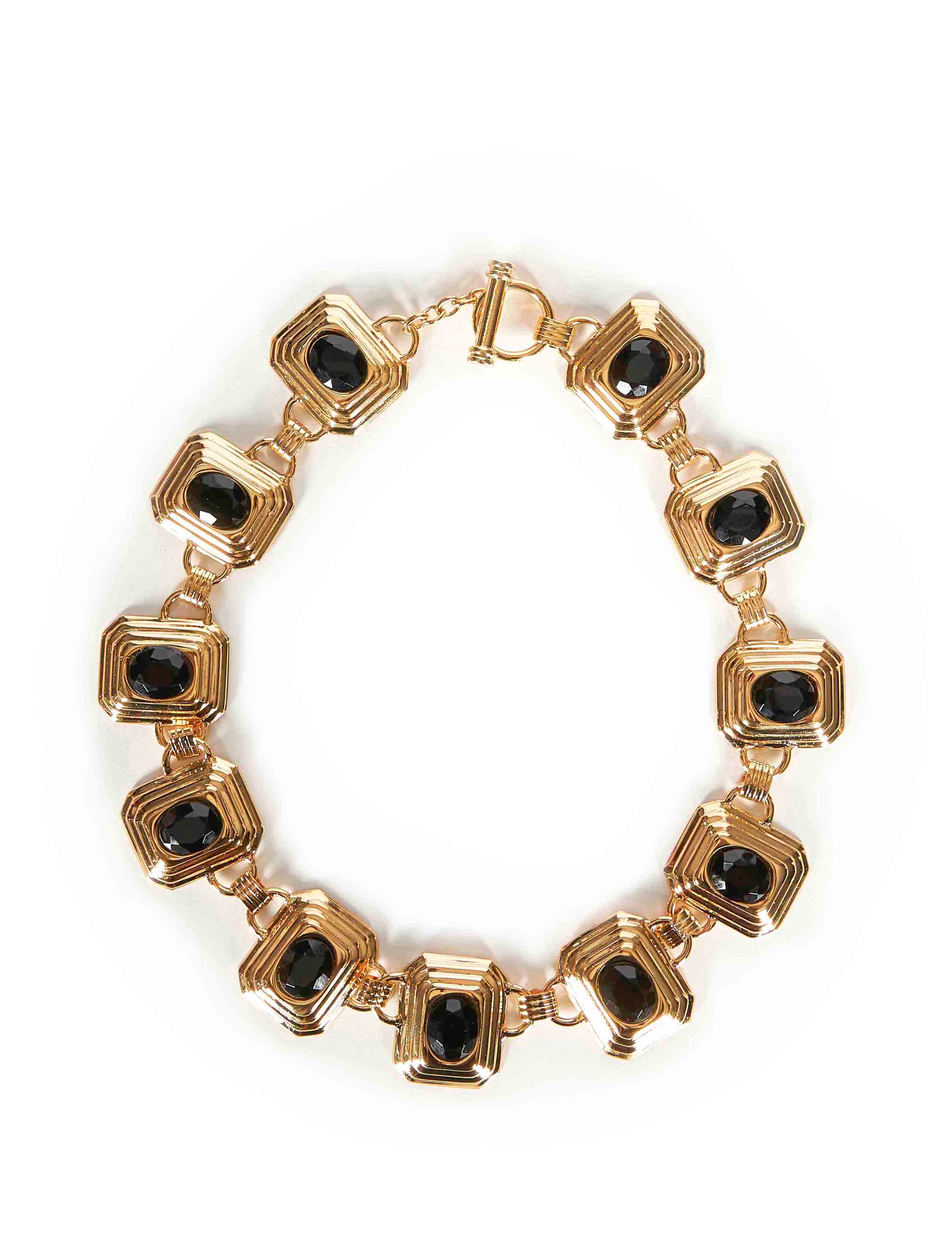 Collana in metallo e cristalli in nero e oro 