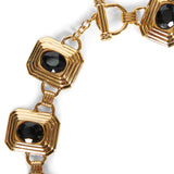 Collana in metallo e cristalli in nero e oro 