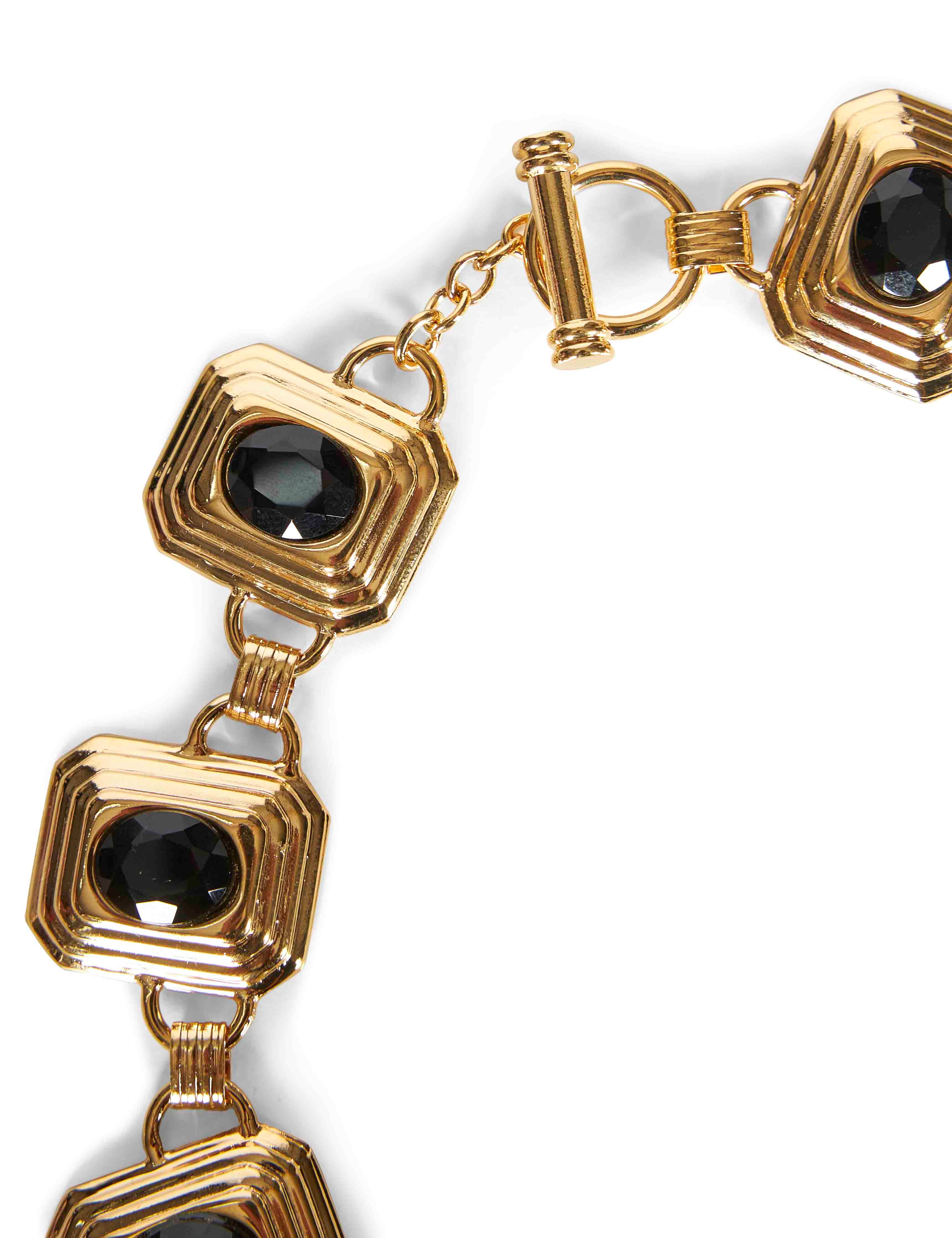 Collana in metallo e cristalli in nero e oro 