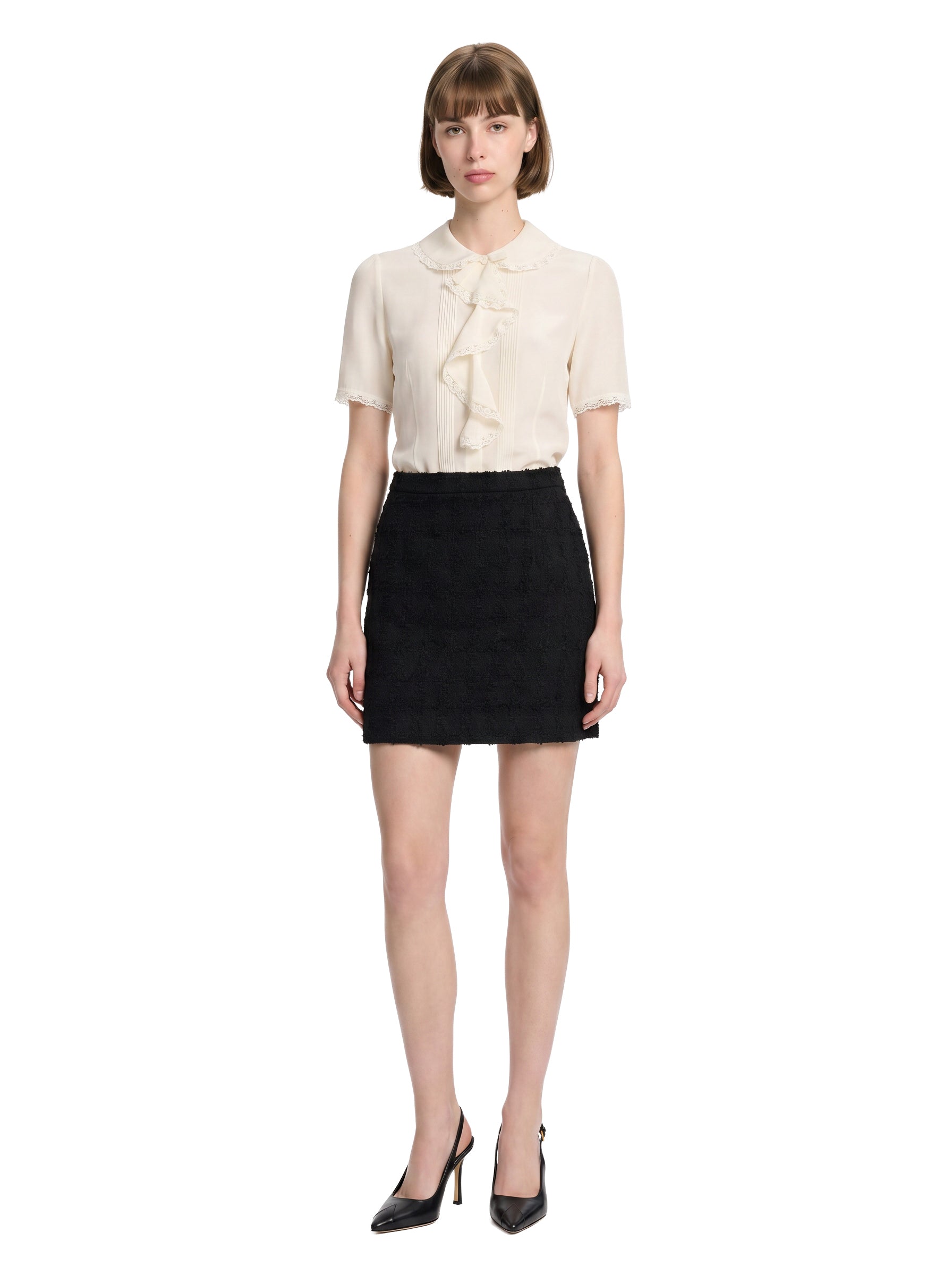 Minigonna bouclè in tweed nero 