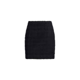 Minigonna bouclè in tweed nero 