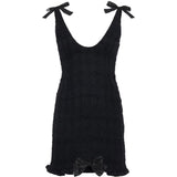 Miniabito bouclé con fiocchi in nero 
