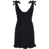 Miniabito bouclé con fiocchi in nero 