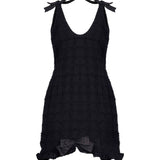 Miniabito bouclé con fiocchi in nero 