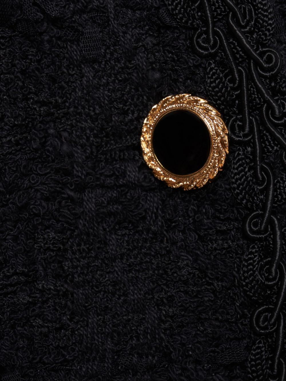 Giacca doppiopetto in tweed bouclé a quadri in nero 