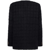 Giacca doppiopetto in tweed bouclé a quadri in nero 