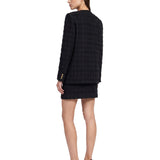 Giacca doppiopetto in tweed bouclé a quadri in nero 