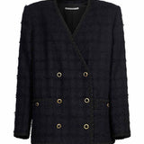 Giacca doppiopetto in tweed bouclé a quadri in nero 
