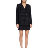 Giacca doppiopetto in tweed bouclé a quadri in nero 