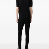 Jeans MX1 con strappi in nero 