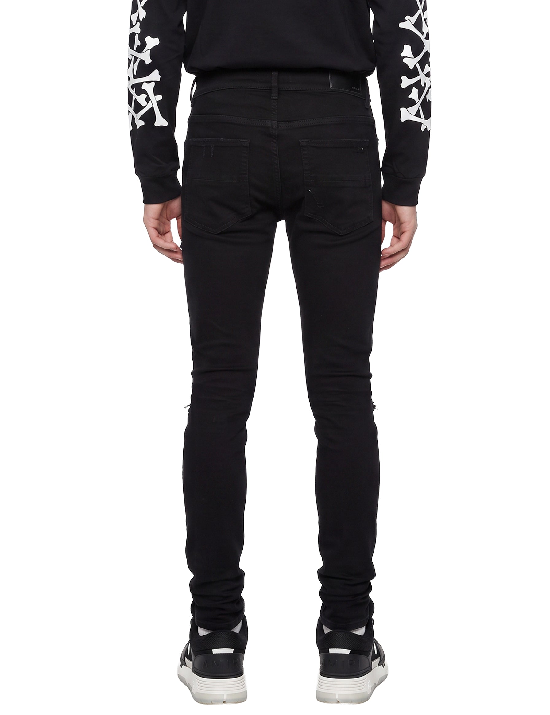 Jeans MX1 con strappi in nero 