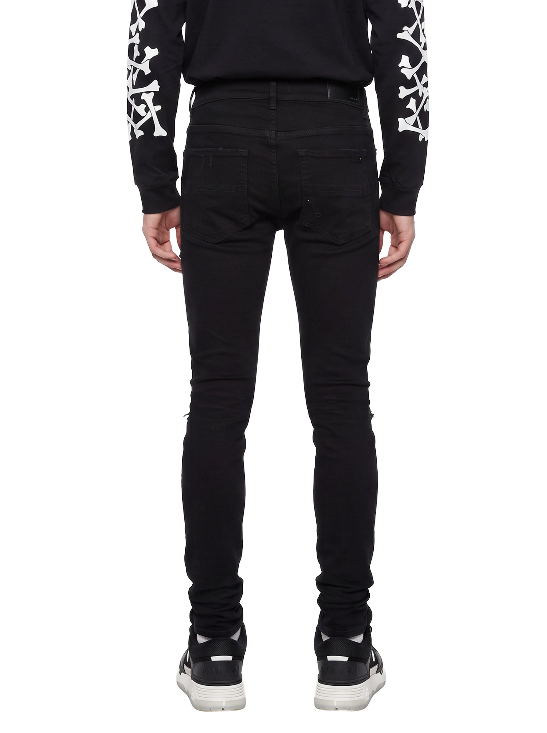 Jeans MX1 con strappi in nero 