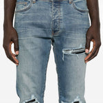 Jeans con strappi in blu 