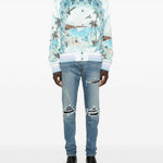 Jeans con strappi in blu 