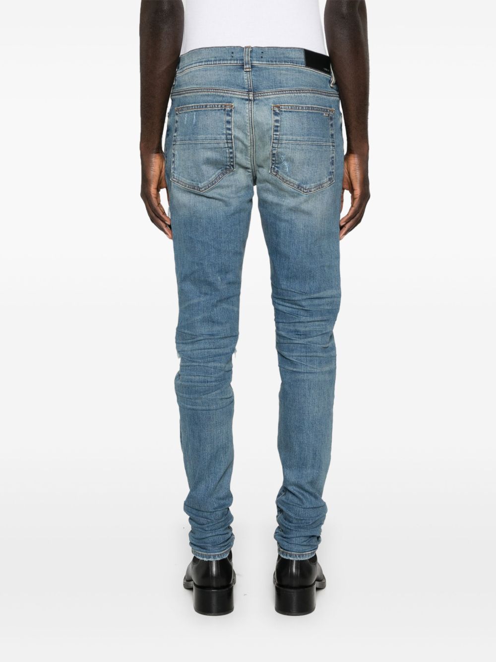 Jeans con strappi in blu 