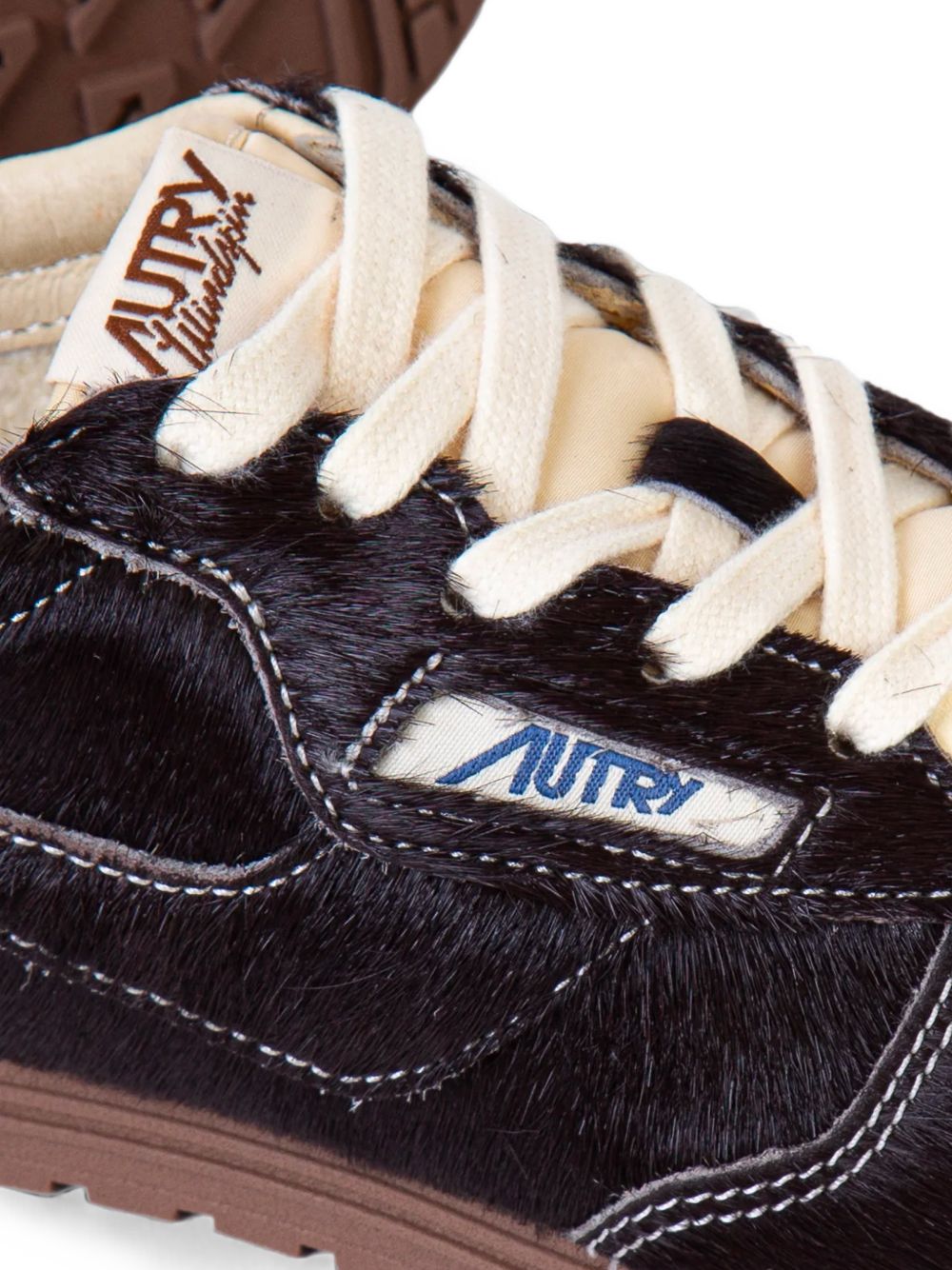 Sneakers basse windspin in marrone 