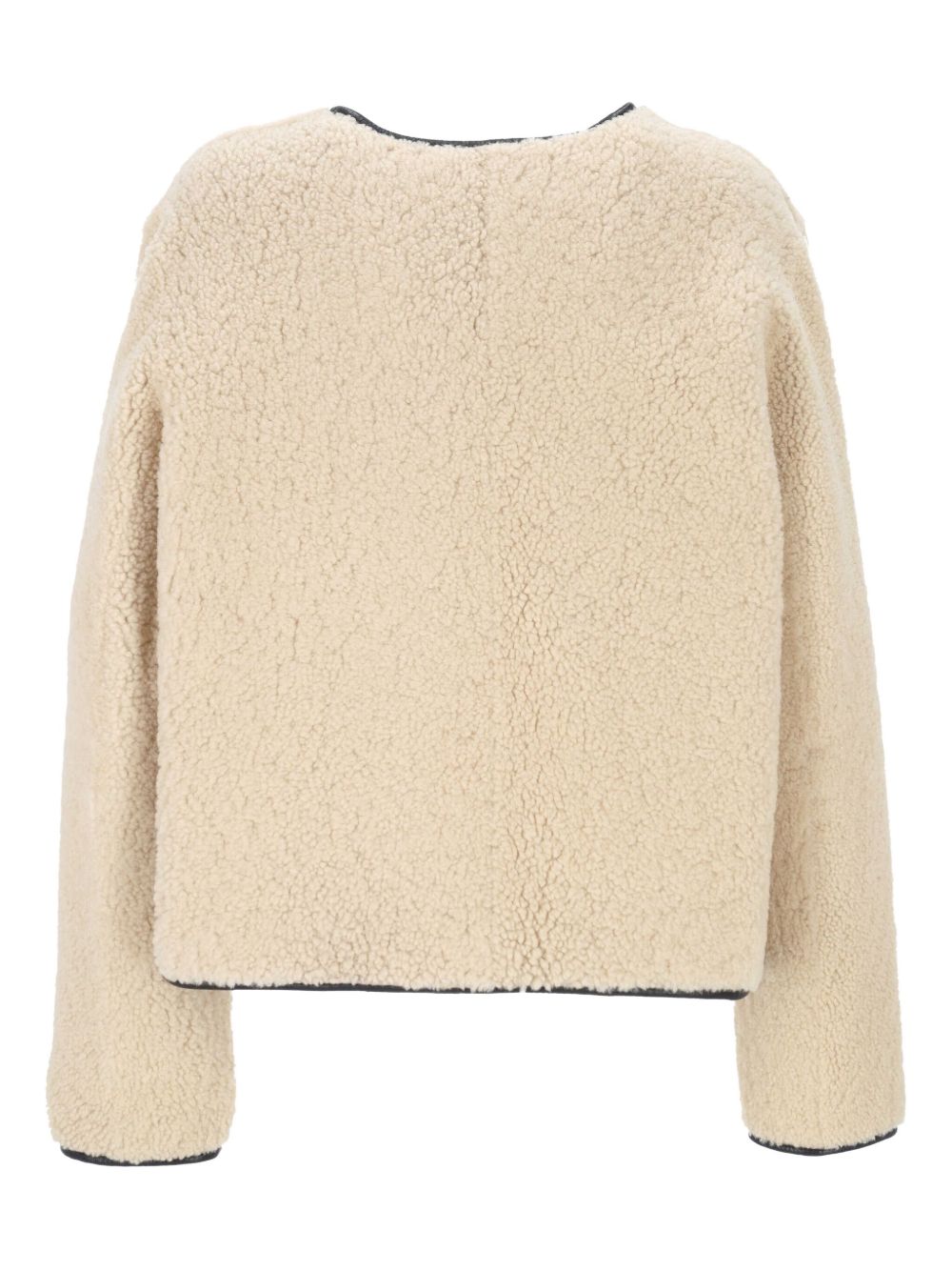 Giacca in montone con abbottonatura in beige 