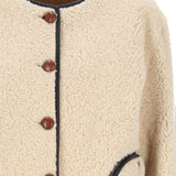 Giacca in montone con abbottonatura in beige 