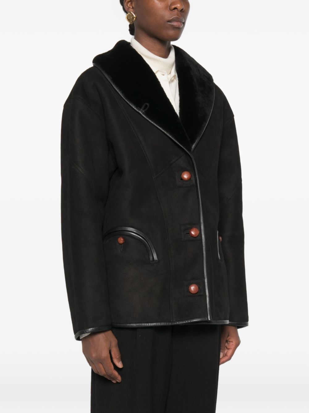 Giacca in shearling con le tasche in nero 