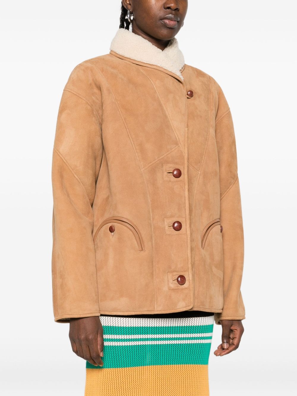 Giacca in shearling con le tasche in beige 