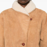 Giacca in shearling con le tasche in beige 