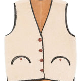 Gilet in shearling con profili in pelle in beige 