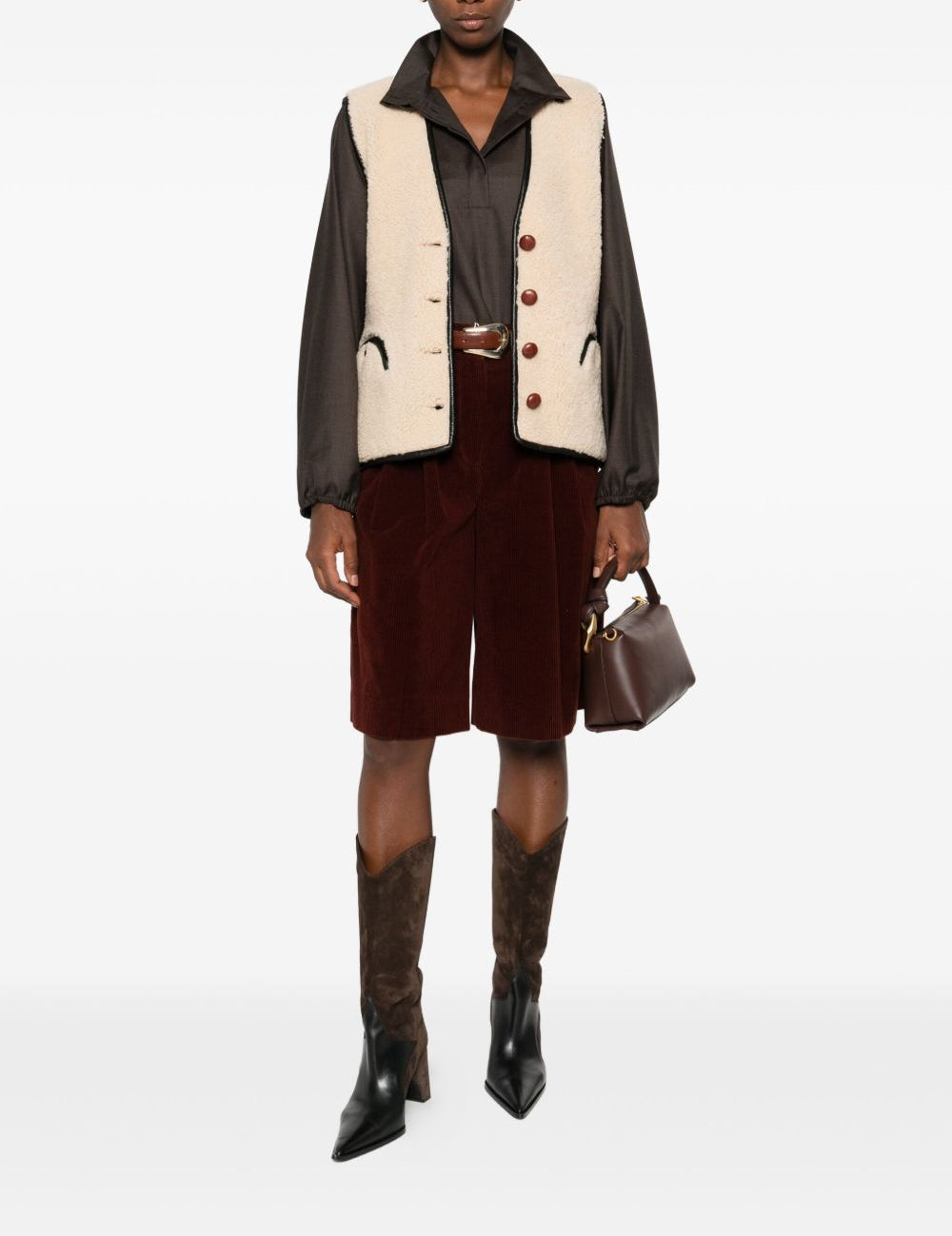 Gilet in shearling con profili in pelle in beige 