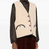Gilet in shearling con profili in pelle in beige 