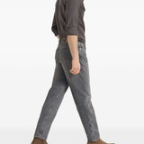 Jeans a cinque tasche in denim grigio con vestibilità iconica. In grigio Brunello cucinelli - uomo 