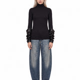 Top con maniche arricciate in nero 