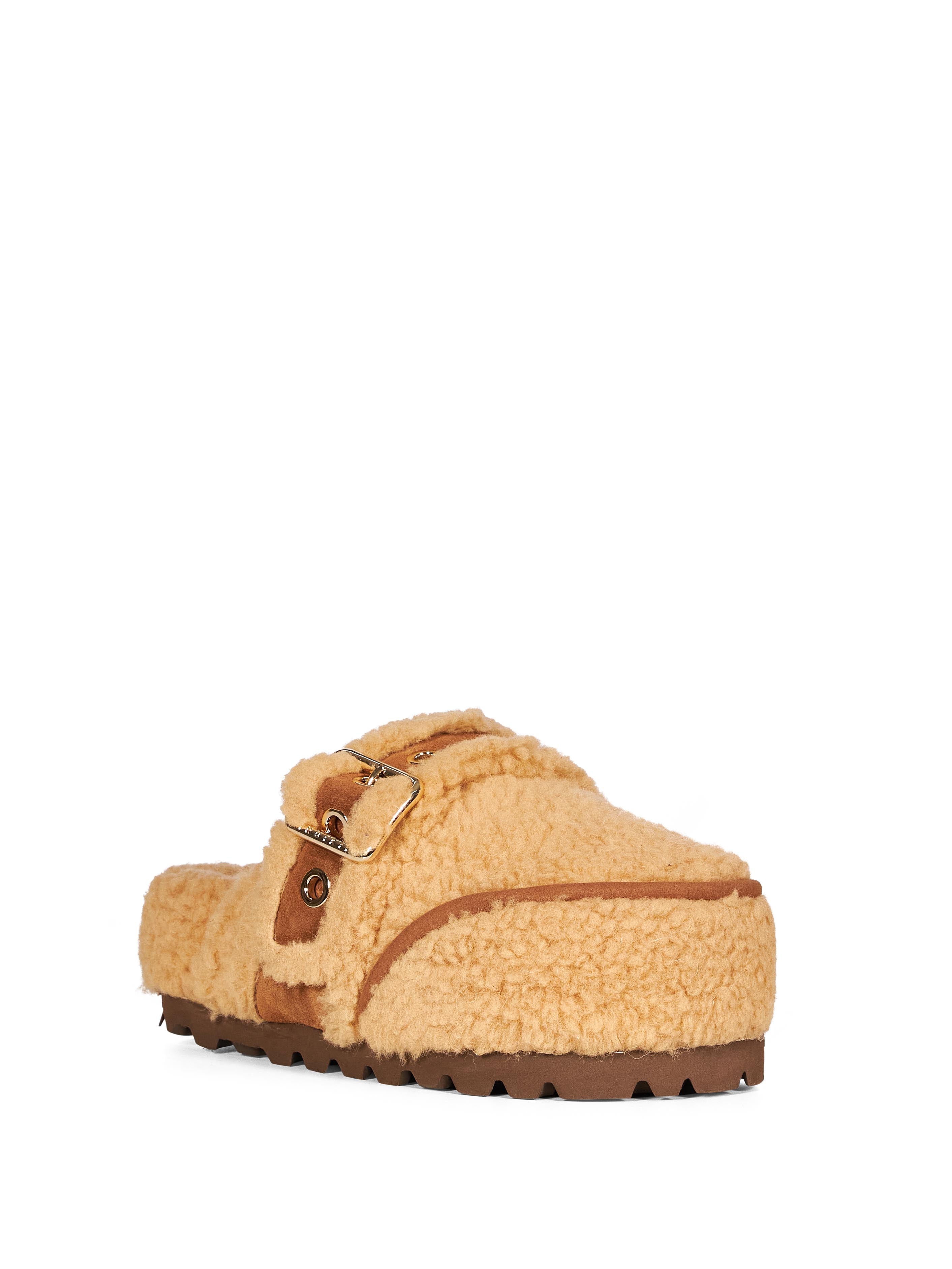 Mules Cozy con cinturino in beige 