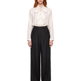 Pantaloni a pieghe in nero 