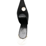Mules con dettaglio a fiore in nero 