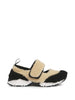 Two-tone shearling sneakers in beige and black