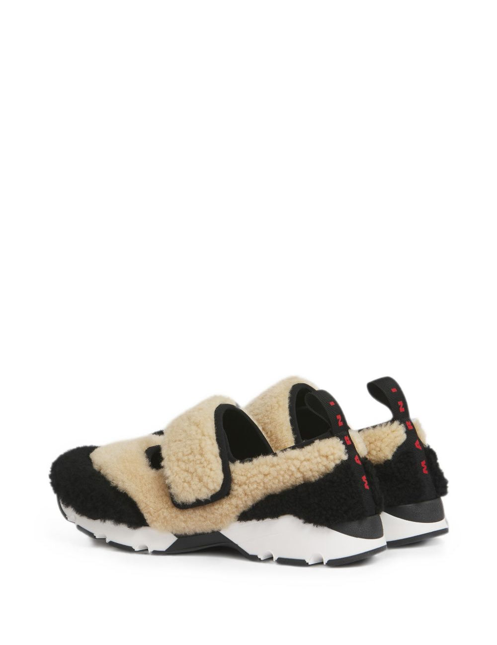 Sneakers in shearling bicolore in beige e nero 