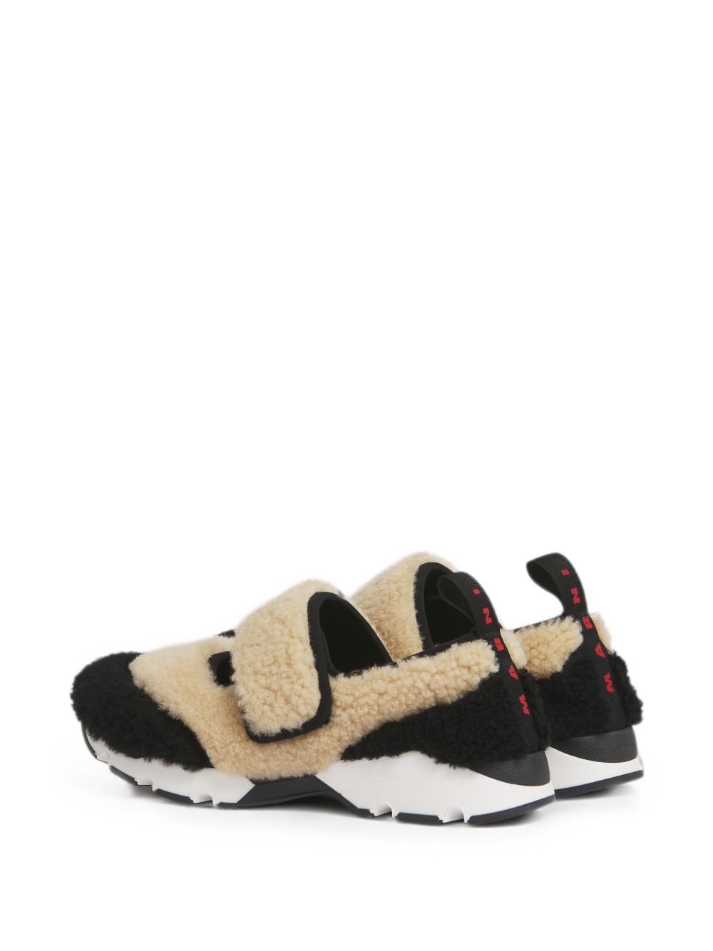 Sneakers in shearling bicolore in beige e nero 